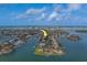 Stunning aerial view of a waterfront community with boats, docks, and easy ocean access at 735 123Rd Ave, Treasure Island, FL 33706