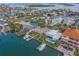 Aerial view of waterfront homes featuring private boat docks and scenic canal access at 735 123Rd Ave, Treasure Island, FL 33706