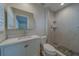 Stylish bathroom features a white vanity, modern faucet and a tiled shower at 735 123Rd Ave, Treasure Island, FL 33706