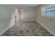 Bright bedroom featuring wood-look flooring, white walls, and window with white shutter-style blinds at 735 123Rd Ave, Treasure Island, FL 33706