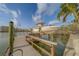 View of boat on lift, showcasing direct water access and the convenience of waterfront living at 735 123Rd Ave, Treasure Island, FL 33706