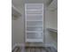 Organized walk-in closet with built-in shelving and ample storage space at 735 123Rd Ave, Treasure Island, FL 33706