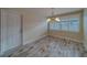 Bright dining room with modern light fixture and direct access to exterior at 735 123Rd Ave, Treasure Island, FL 33706