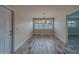 Dining room with modern light fixture and plantation shutters for ample light control at 735 123Rd Ave, Treasure Island, FL 33706