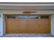 Close up of paneled garage door with decorative hardware at 735 123Rd Ave, Treasure Island, FL 33706
