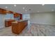 Spacious kitchen featuring a large island, stainless steel appliances, and wood-look tile flooring at 735 123Rd Ave, Treasure Island, FL 33706