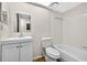 Bathroom with tile floors, vanity with mirror, toilet, and a bathtub with tiled wall surround at 7821 Niagara Ave # 2102, Tampa, FL 33617