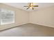Bedroom features carpet floors, ceiling fan, a window for natural light at 7821 Niagara Ave # 2102, Tampa, FL 33617