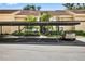 Well-lit carport with parking spots and landscaping surrounding the complex at 7821 Niagara Ave # 2102, Tampa, FL 33617