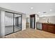 The kitchen features wood floors, wood cabinets, stainless steel appliances, and access to the patio at 7821 Niagara Ave # 2102, Tampa, FL 33617