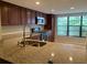 Updated kitchen features granite counters, stainless appliances, and ample cabinet space at 7821 Niagara Ave # 2102, Tampa, FL 33617