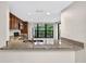 Kitchen with granite countertops, stainless steel appliances, and a bright view through the window at 7821 Niagara Ave # 2102, Tampa, FL 33617