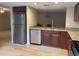 Kitchen with granite countertops, stainless dishwasher, and tile flooring at 7821 Niagara Ave # 2102, Tampa, FL 33617