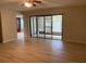 Bright living room showing sliding glass doors to enclosed patio at 7821 Niagara Ave # 2102, Tampa, FL 33617