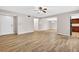 Bright, open living space with wood-look tile flooring, neutral walls, and ample closet space at 7821 Niagara Ave # 2102, Tampa, FL 33617