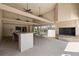 Covered outdoor pavilion featuring a bar, fireplace, and ample seating for entertaining at 7821 Niagara Ave # 2102, Tampa, FL 33617