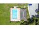 Aerial view of a community pool with lounge chairs, clear water, and well-maintained surrounding landscaping at 7821 Niagara Ave # 2102, Tampa, FL 33617
