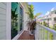 Balcony showcasing potted plants and views of the surrounding neighborhood at 803 Oak Bend Ln, Dunedin, FL 34698