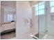 Bright bathroom visible from the bedroom with white tile and modern fixtures at 803 Oak Bend Ln, Dunedin, FL 34698