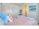 Bright bedroom featuring a closet and shelves for extra storage at 803 Oak Bend Ln, Dunedin, FL 34698
