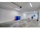 Garage with bright lighting and ample space, ideal for a workshop or storage, includes fitness area and utilities at 803 Oak Bend Ln, Dunedin, FL 34698