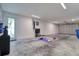 Spacious garage that doubles as a home gym, with workout equipment and ample room for fitness activities at 803 Oak Bend Ln, Dunedin, FL 34698