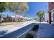 Charming street view with quaint storefronts, lush landscaping, and a clear sky, creating a welcoming atmosphere at 803 Oak Bend Ln, Dunedin, FL 34698