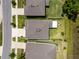 Aerial view of the property showcasing its layout, backyard, and proximity to neighboring homes at 8423 Praise Dr, Tampa, FL 33625