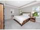Bedroom with neutral tones, recessed lighting, a king size bed, and exterior views at 8423 Praise Dr, Tampa, FL 33625