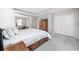 Spacious bedroom featuring tray ceilings, a king-size bed, and an attached sitting area at 8423 Praise Dr, Tampa, FL 33625