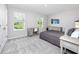 Serene bedroom with neutral decor, a study area, and soft carpet creates a calming and functional space at 8423 Praise Dr, Tampa, FL 33625