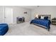 Cozy bedroom featuring neutral tones, a comfy blue bed, desk, and beanbag for relaxation and study at 8423 Praise Dr, Tampa, FL 33625