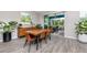 Dining room with wood table, chairs, and sliding door to outdoor patio at 8423 Praise Dr, Tampa, FL 33625