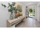 Bright entryway with stylish decor, a console table, and views of the front yard at 8423 Praise Dr, Tampa, FL 33625