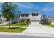 Charming two-story home with manicured landscaping and a basketball hoop in the driveway at 8423 Praise Dr, Tampa, FL 33625
