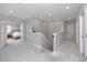 Hallway showing carpeted flooring with three white paneled doors and a view to a bedroom at 8423 Praise Dr, Tampa, FL 33625