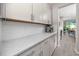 Kitchen area featuring light gray cabinets and stainless steel appliances at 8423 Praise Dr, Tampa, FL 33625