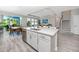 Spacious kitchen with island, stainless dishwasher, and adjacent dining/living spaces at 8423 Praise Dr, Tampa, FL 33625