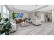 Bright living room with modern furnishings, staircase, and lots of light at 8423 Praise Dr, Tampa, FL 33625