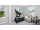 Sitting area showcases natural light and a comfortable chair with end tables at 8423 Praise Dr, Tampa, FL 33625