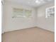 Bedroom with carpeted floor and natural light from two windows with blinds at 8501 56Th N St, Pinellas Park, FL 33781