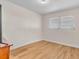 Neutral bedroom features wood-look flooring and natural light from two windows at 8501 56Th N St, Pinellas Park, FL 33781
