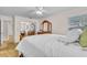 Spacious bedroom with a ceiling fan, closet, and natural light coming in through the window at 8501 56Th N St, Pinellas Park, FL 33781