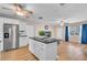 Spacious kitchen with a large island, stainless steel appliances, and tile flooring at 8501 56Th N St, Pinellas Park, FL 33781