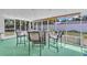 Enclosed sunroom with outdoor furniture, providing a relaxing view of the backyard at 8501 56Th N St, Pinellas Park, FL 33781