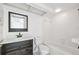Clean bathroom with modern vanity, sink, and bathtub at 8645 Piper Ln, Seminole, FL 33777