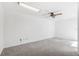 Bonus room featuring neutral carpeting, a ceiling fan, and ample space at 8645 Piper Ln, Seminole, FL 33777