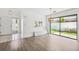 Bright dining room with sliding glass doors and views of the outdoor area at 8645 Piper Ln, Seminole, FL 33777