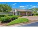 Beautiful exterior view of a single-story home with a well-maintained front yard and a spacious two-car garage at 8645 Piper Ln, Seminole, FL 33777