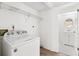 Practical laundry area with modern appliances and extra storage space at 8645 Piper Ln, Seminole, FL 33777